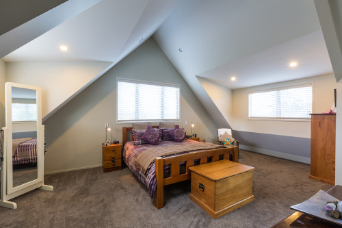 master bedroom, pitched roofline, high ceiling, cream walls, cream paint