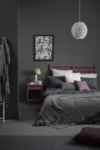 A sophisticated slate bedroom gets a tropical twist