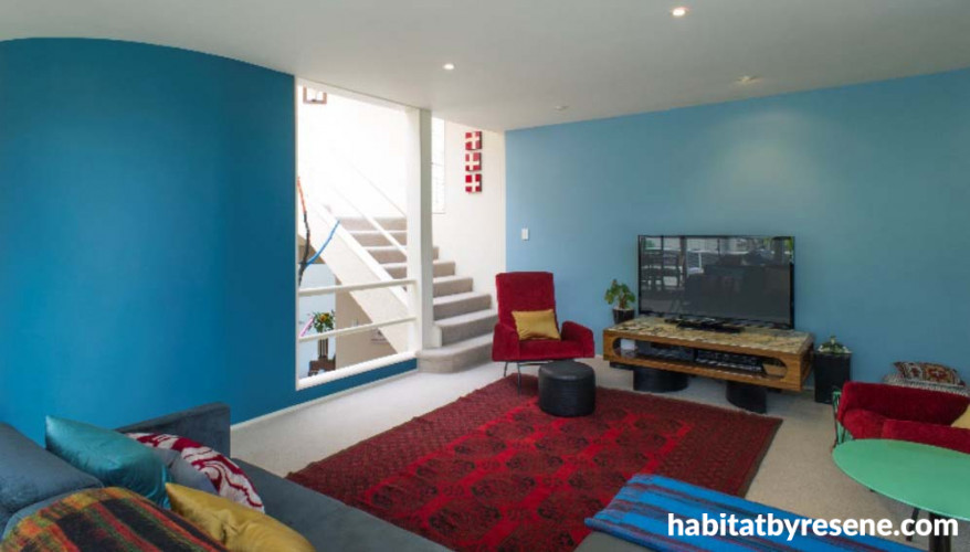 family room, lounge, living room, blue lounge, blue and red, colourful living room