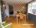 retro, retro house, 1970s home, dining room, wallpaper feature wall, retro wallpaper, grey, orange 