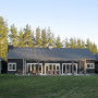 house exterior, barn style house, black house, black exterior, outdoor living area 
