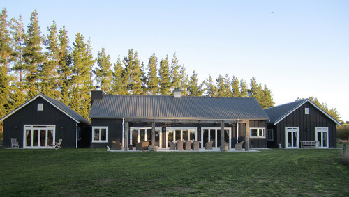 house exterior, barn style house, black house, black exterior, outdoor living area