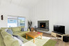 living room, lounge, white living room, paneled walls paneled ceiling, fireplace, white interior 