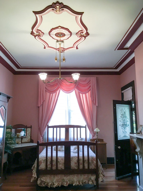 bedroom, pink bedroom, pink and red paint, ceiling rose, metallic gold, ceiling