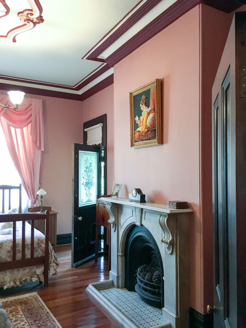 bedroom, red bedroom, fireplace, rose paint, pink bedroom