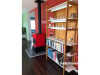 red dining room, red fireplace, fire place inspiration, open plan living, bookshelf, Resene