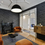 lounge, living room, wallpaper feature wall, grey wallpaper, grey and orange, grey lounge