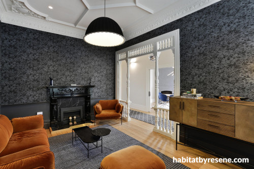 lounge, living room, wallpaper feature wall, grey wallpaper, grey and orange, grey lounge