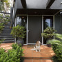 front door, entranceway, 1980s house, contemporary home, black painted exterior