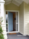 cream white exterior, blue door, resene bali hai, resene half pavlova, California bungalow style