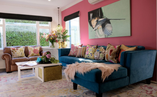 living room, lounge, pink lounge, pink feature wall, blue sofa, pink and blue, resene rouge
