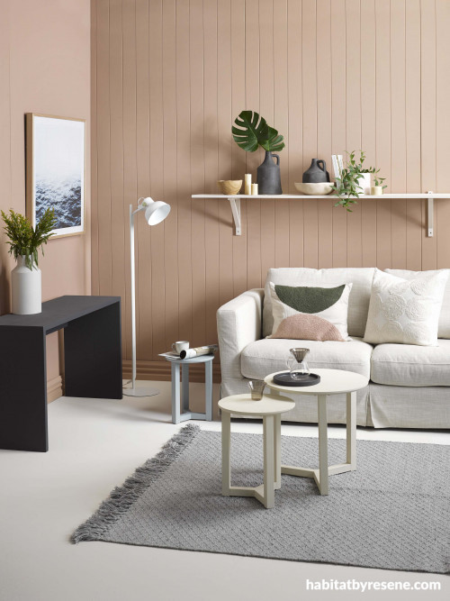 living room, lounge, pink living room, brown living room, white couch, grey rug 