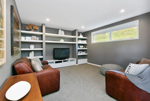 Lounge, living room, grey interior, grey and white, shelving, couch, brown