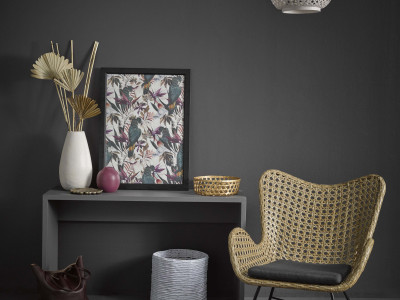 A sophisticated slate bedroom gets a tropical twist