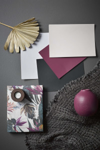 A sophisticated slate bedroom gets a tropical twist