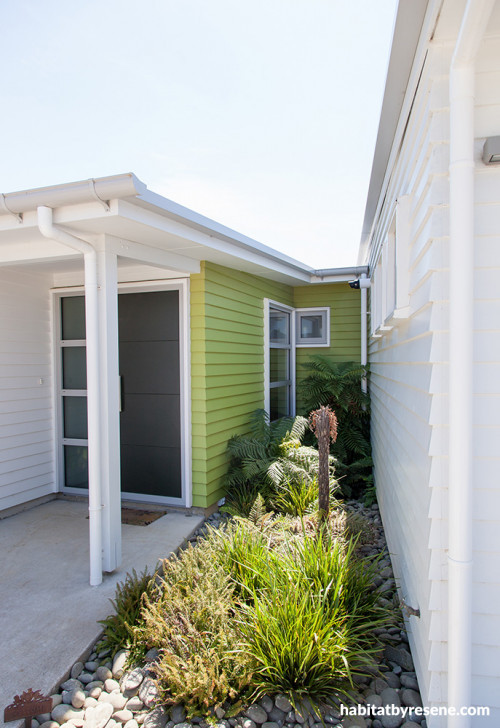 painted weatherboards, white house, green feature wall, green entranceway, house exterior