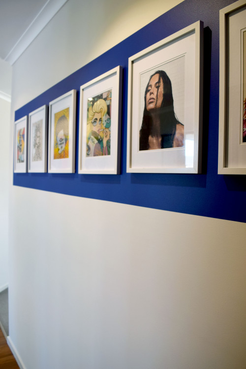 blue feature wall, hanging artwork, photography as art, white walls, blue paint, resene decadence