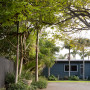 entrance, garden, tree lined entranced, grey house, grey exterior, blue house, blue exterior 