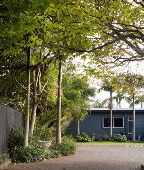 entrance, garden, tree lined entranced, grey house, grey exterior, blue house, blue exterior