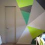 geometric painted wall, office, grey study, shades of green paint, interior design 