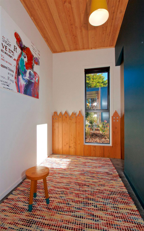 hallway, holiday cabin, dark blue feature wall, timber ceiling, play area