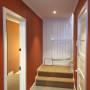 hallway, stairwell, burnt orange paint, orange hallway, orange stairwell