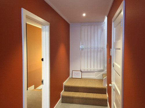 hallway, stairwell, burnt orange paint, orange hallway, orange stairwell