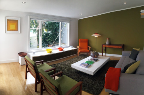lounge, living room, green feature wall, retro furniture, green lounge, green paint