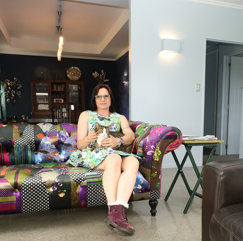 living room, lounge, blue dining room, coloured couch, white hallway