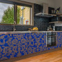 kitchen, blue kitchen, blue and gold cabinetry, patterned cabinetry, grey kitchen