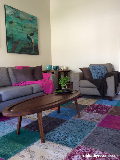 living room, lounge, neutrals, colourful accessories, colourful rug 