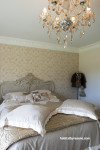 bedroom, master bedroom, patterned wallpaper, neutrals, feature wall, chandelier 
