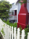 house exterior, villa exterior, painted weatherboards, red chimney