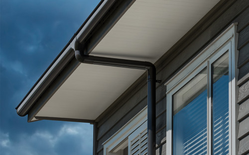 black house, house exterior, black downpipes, cedar weatherboards, stained weatherboards