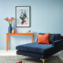 blue living room, blue lounge, blue feature wall, blue room, blue interior, blue and orange