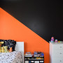 orange feature wall, orange and black, kids room, boys room, resene adrenalin, resene all black