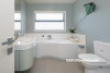 blue bathroom, beach house, white cabinetry, interior