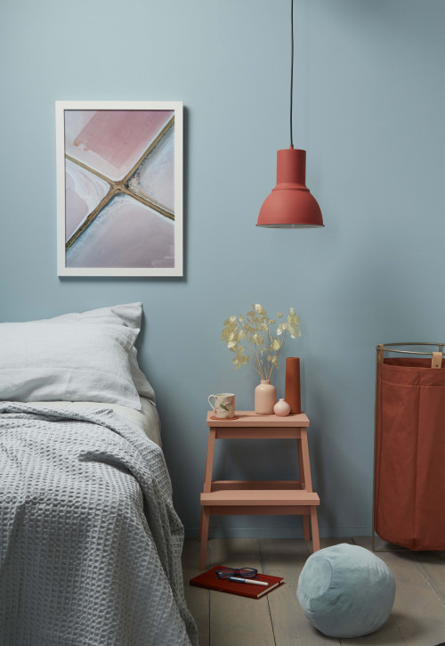 bedroom, blue bedroom, blue and orange, orange accessories, blue feature wall