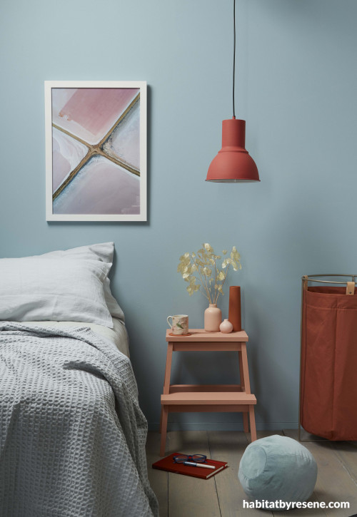 bedroom, blue bedroom, blue and orange, orange accessories, blue feature wall