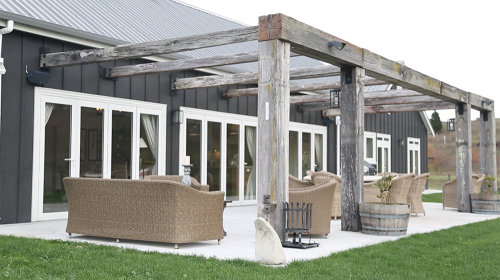house exterior, barn style house, black house, black exterior, outdoor living area