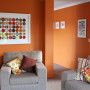 lounge, living room, orange lounge, orange living room, bright living room, orange paint 