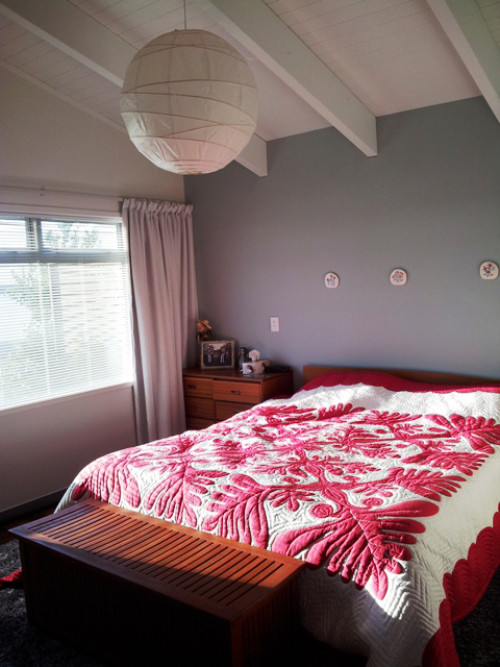 bach, holiday home, beach house, bedroom, master bedroom, grey feature wall, grey bedroom