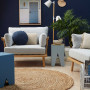 blue living room, blue lounge, resene indian ink, plywood floors, round jute rug, dark feature wall