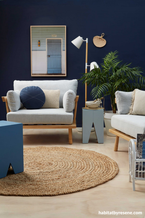 blue living room, blue lounge, resene indian ink, plywood floors, round jute rug, dark feature wall