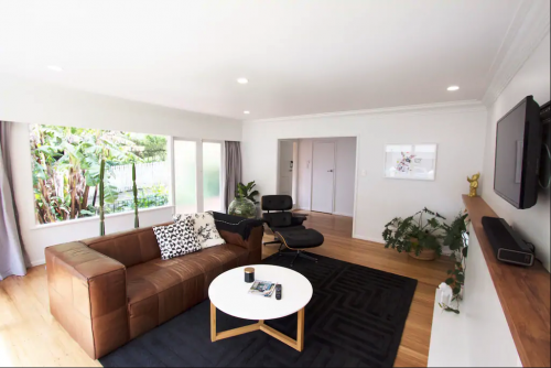 white lounge, white living room, neutral lounge, timber flooring, brown couch, resene black white