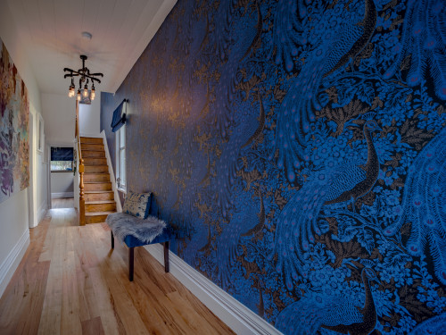 hallway, blue wallpaper, peacock wallpaper, blue feature wall, wallpaper feature, blue hallway