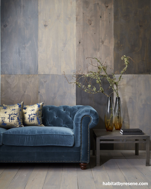 plywood feature wall, stained plywood, feature wall, nature inspired wall, blue sofa, lounge