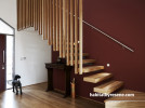 brown entranceway, wooden stairwell, brown painted wall, feature wall, interior