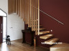 brown entranceway, wooden stairwell, brown painted wall, feature wall, interior