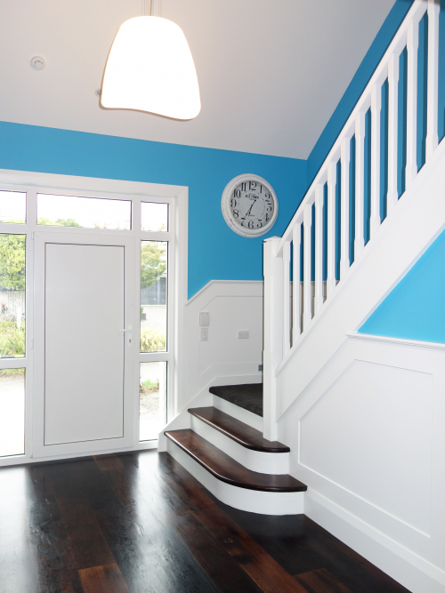 white stairs, white staircase, blue, bright blue, hallway, painted panels, paint ideas, paint trends